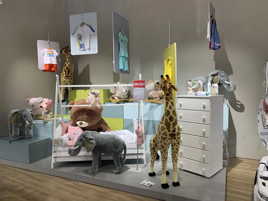 Aksa baby store display with nursery products and animal decor