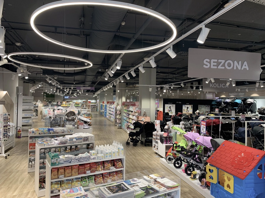 Aksa retail interior with circular ceiling lights and baby product displays