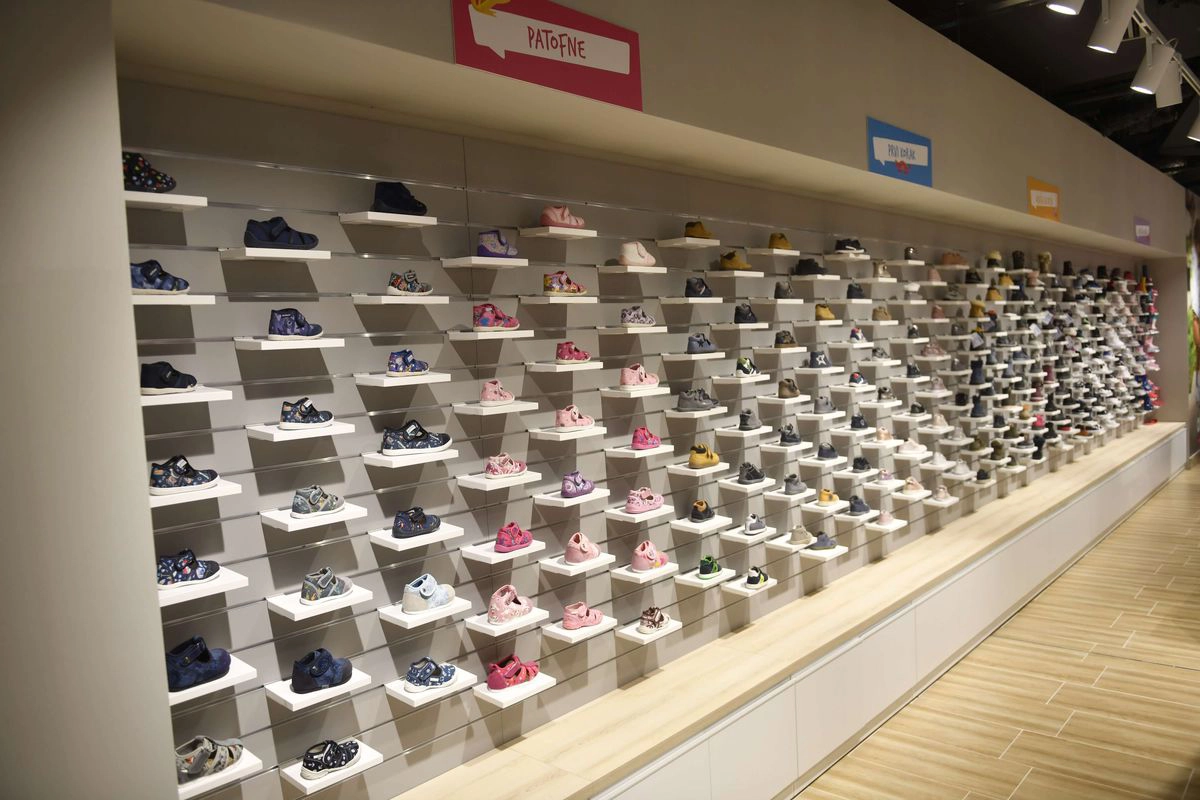 Children’s footwear wall display inside Aksa store