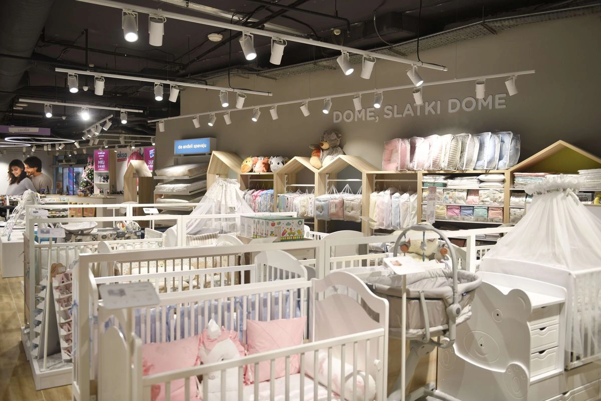 Aksa baby furniture section with cribs and bedding displays
