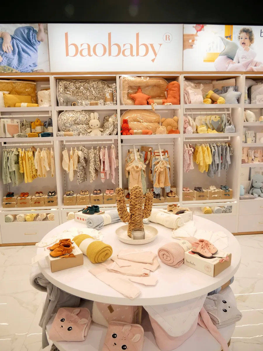 Baby Shop Premium baby clothing display with soft retail interior design