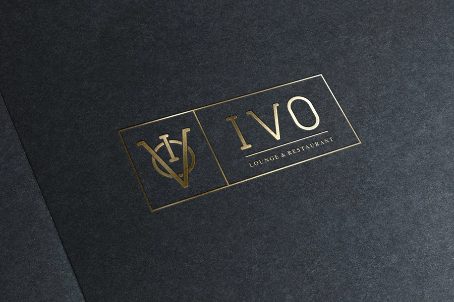 IVO restaurant logo embossed on a dark menu cover